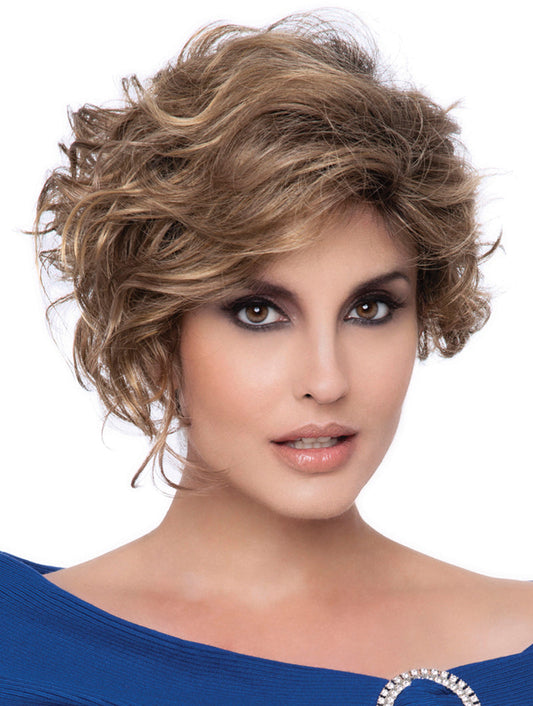 headshot of model wearing brown curly wig