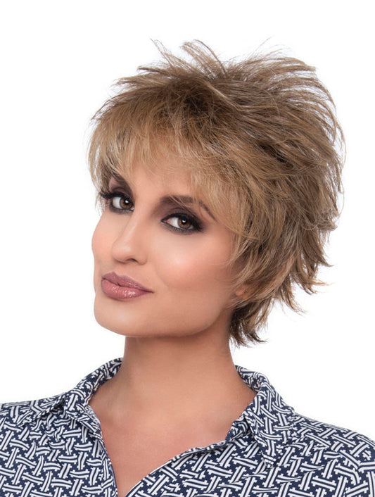 headshot of model wearing light brown spiky style wig
