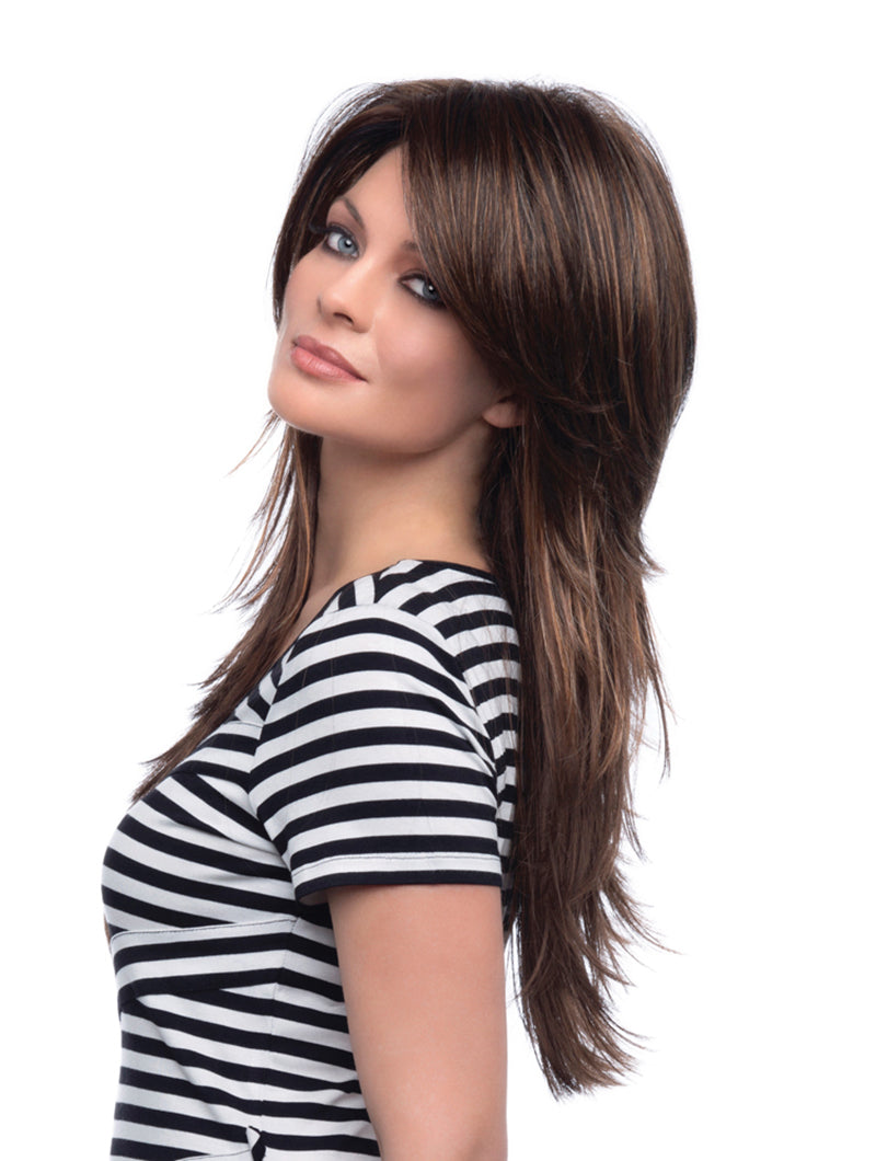 side shot of model wearing long brown wig with layers